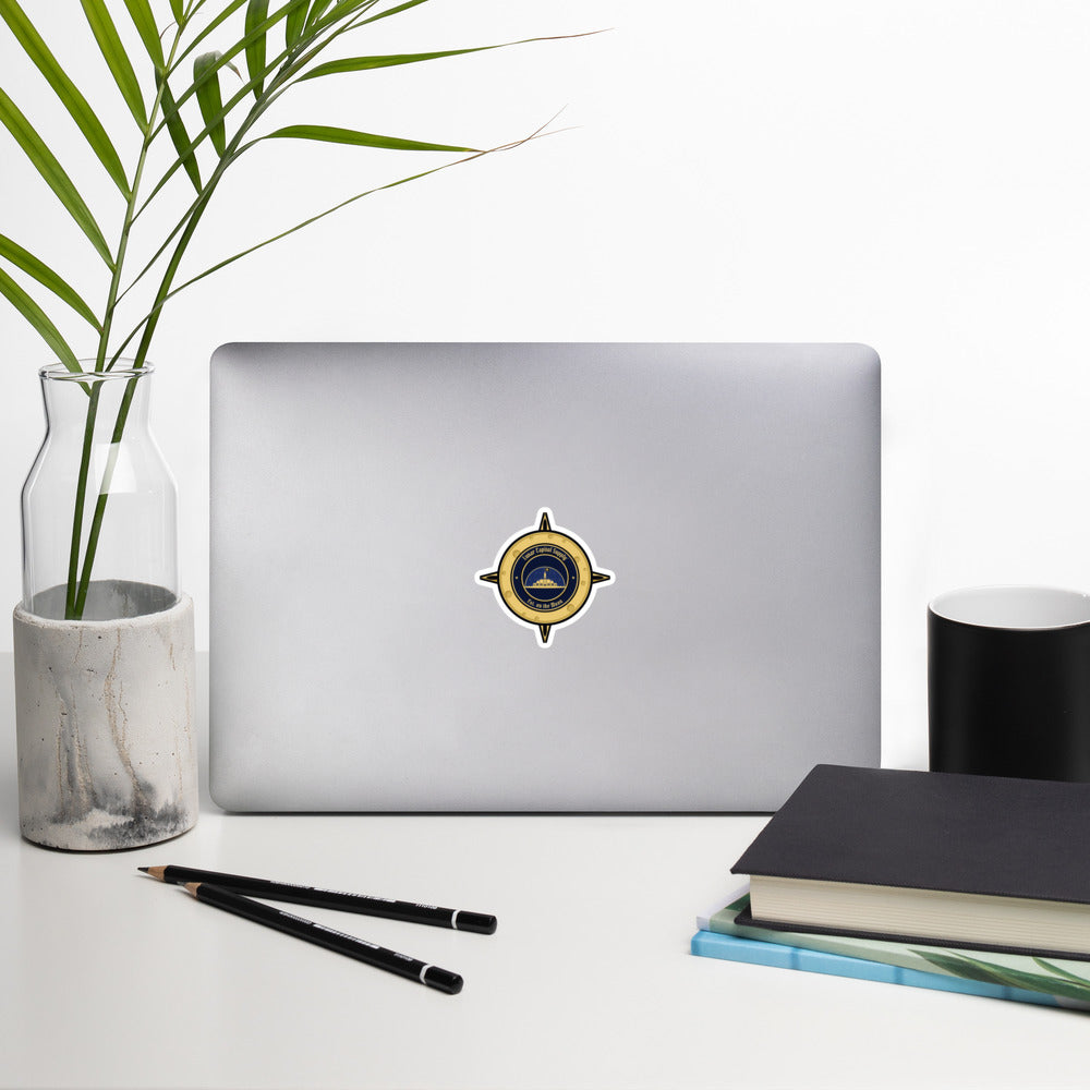 3 inch Lunar Capitol Dome Crest Sticker on the back of an open laptop on a white desk